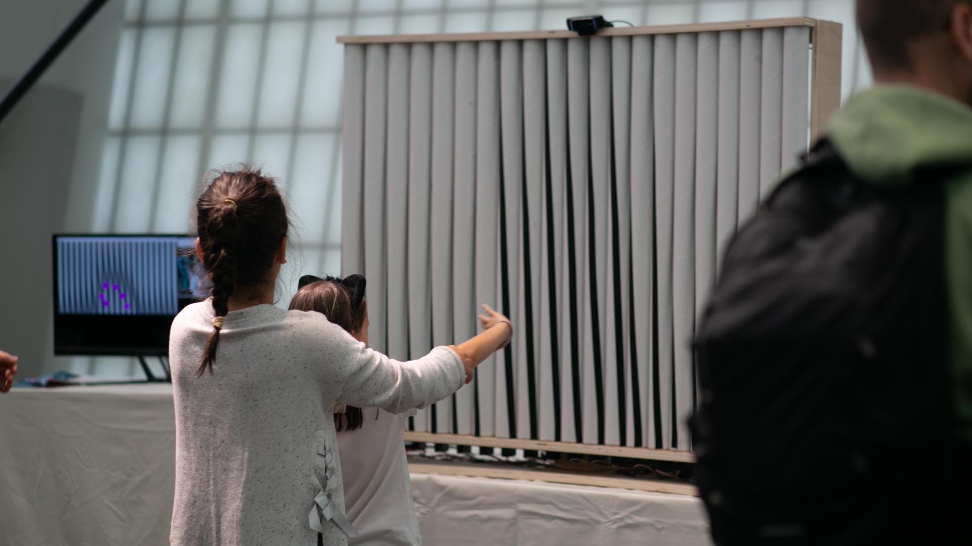 The installation would get glitchy when multiple people stood next to each other in front of it, as it would jump between having each of them control it. It proved challenging to have the same person control it between each frame.