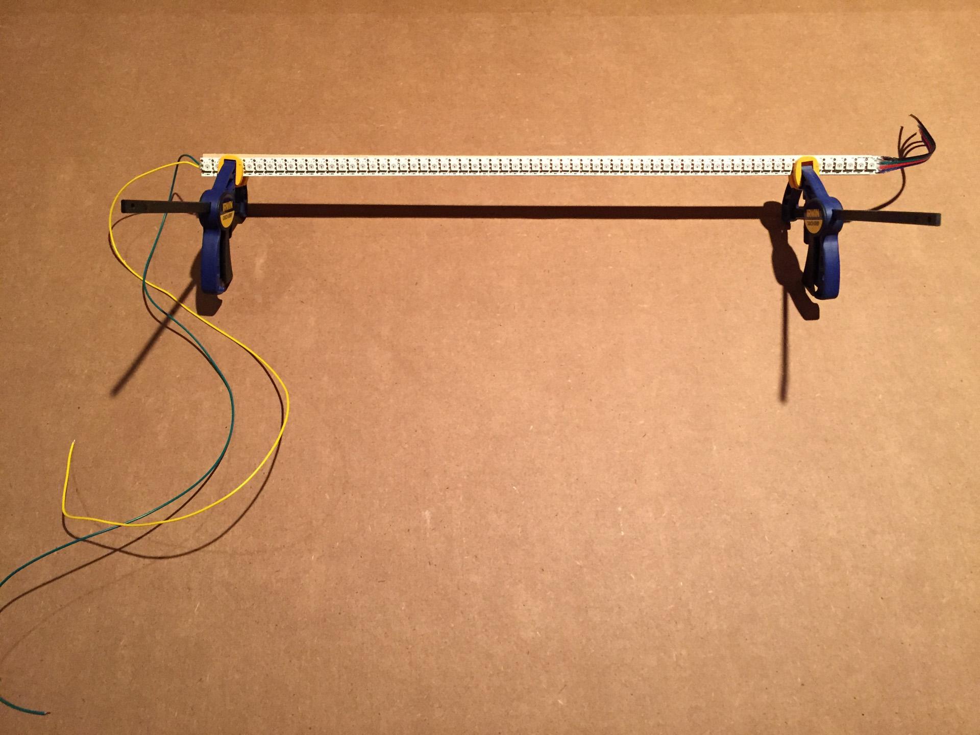 Glueing led strip to semi-circular shaped dowel.